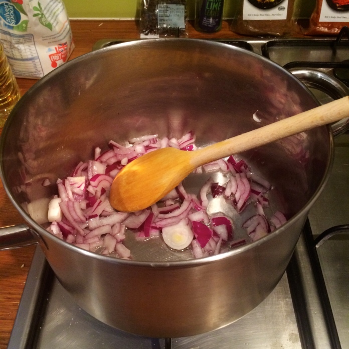 Start by frying the red onion  until they start to wilt. 
