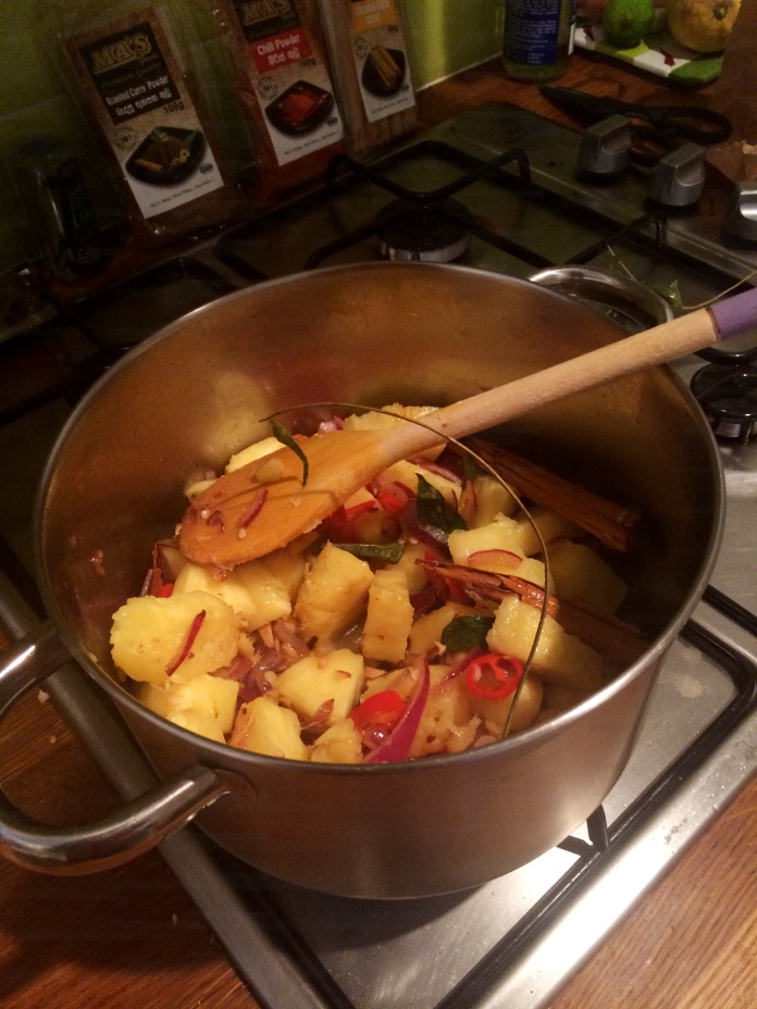 After a few minutes, add in the fresh cubed pineapple and fry into the onion mixture. 