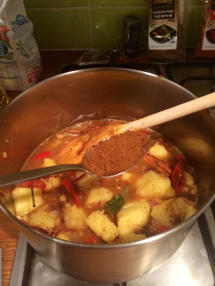 Add one leveled tablespoon of roasted curry powder to the mixture and half a leveled tablespoon of chili powder. 